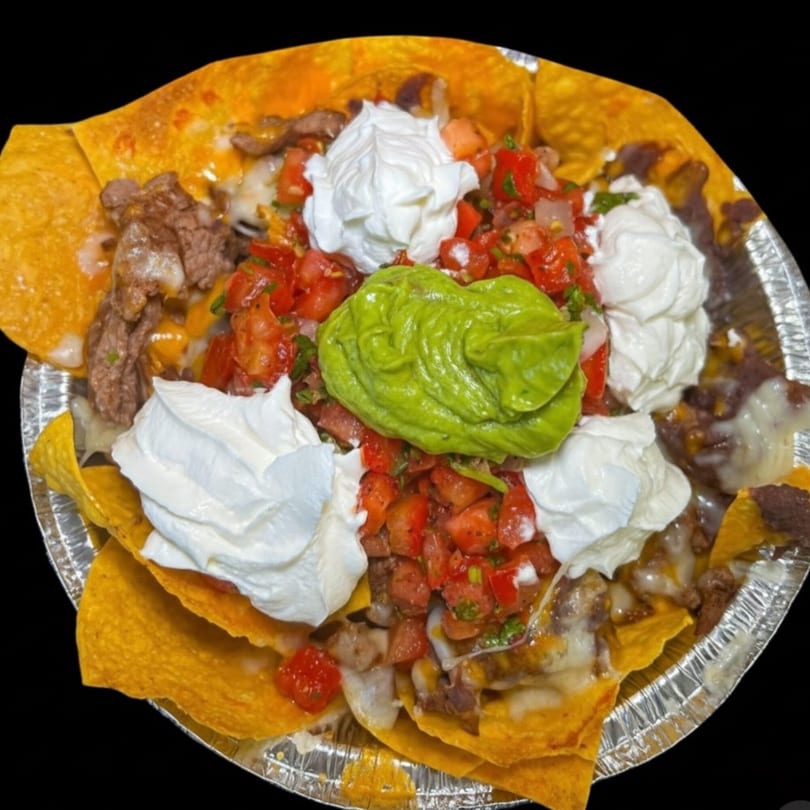 Flying Burro's carne asada nachos with guacamole, sour cream, and pico de gallo.