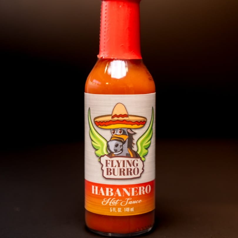 Flying Burro Habanero Hot Sauce bottle with a winged donkey wearing a sombrero on the label.